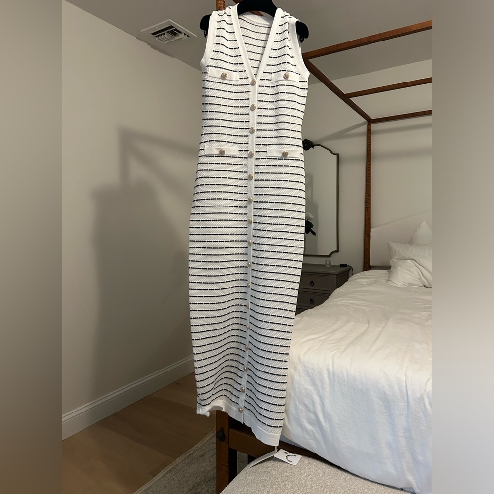 Black and white striped knit dress with gold buttons